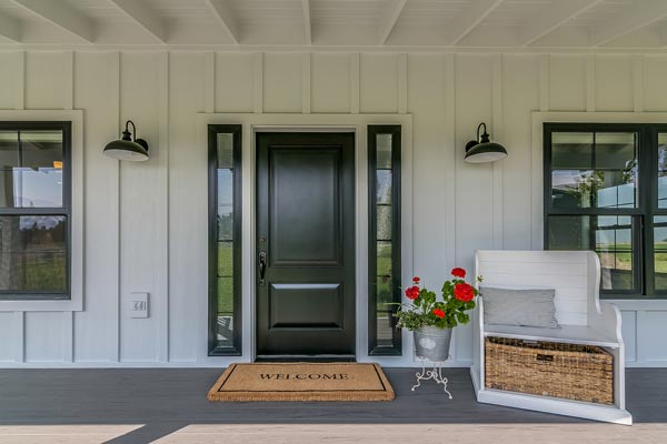 Large front porch with black door