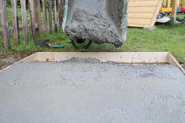 Pouring fresh cement in a hole